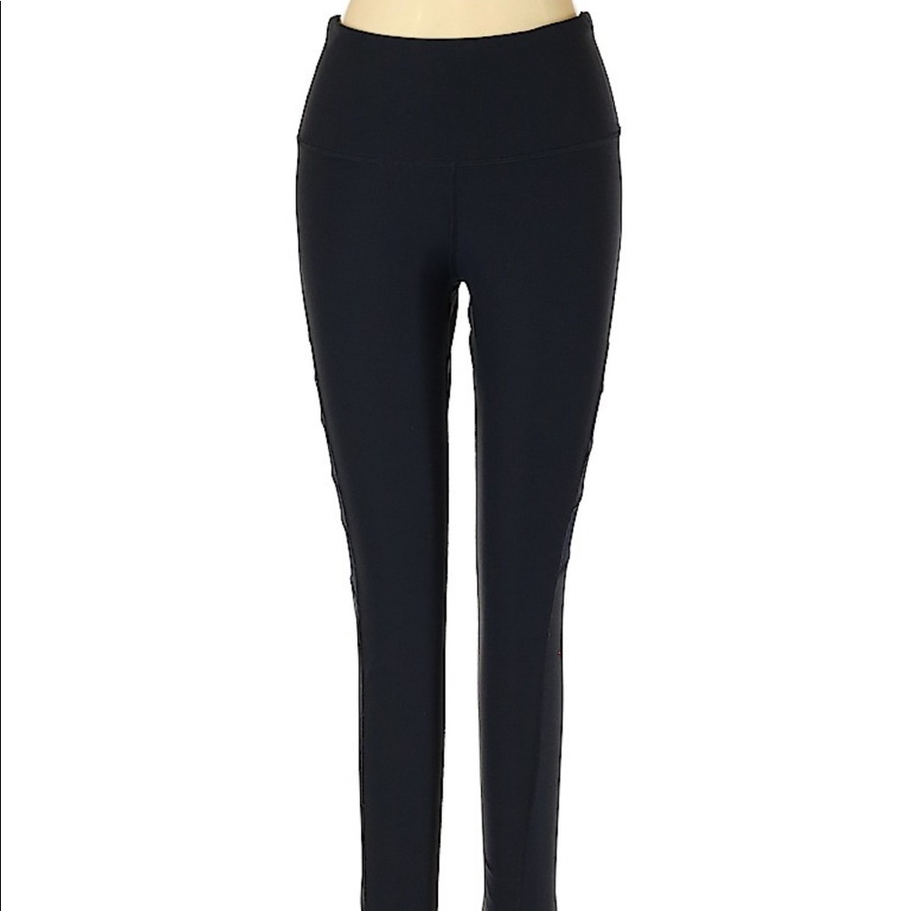 Yoga pants with mesh inlay on side of leg